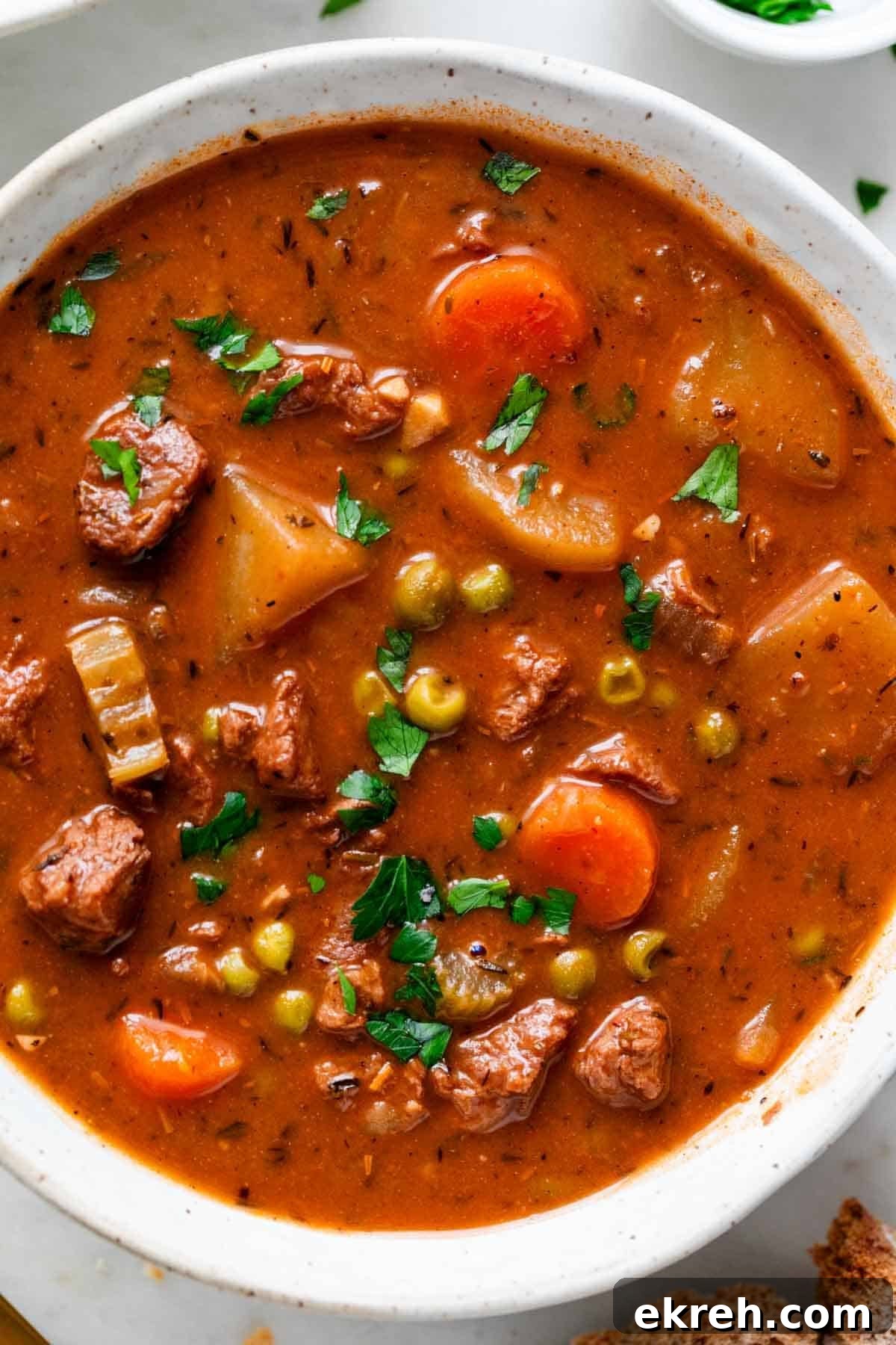 Hearty Vegan Beef-Style Stew with Plant-Based Chunks 11 Vegan beef stew served in a bowl with parsley on top.
