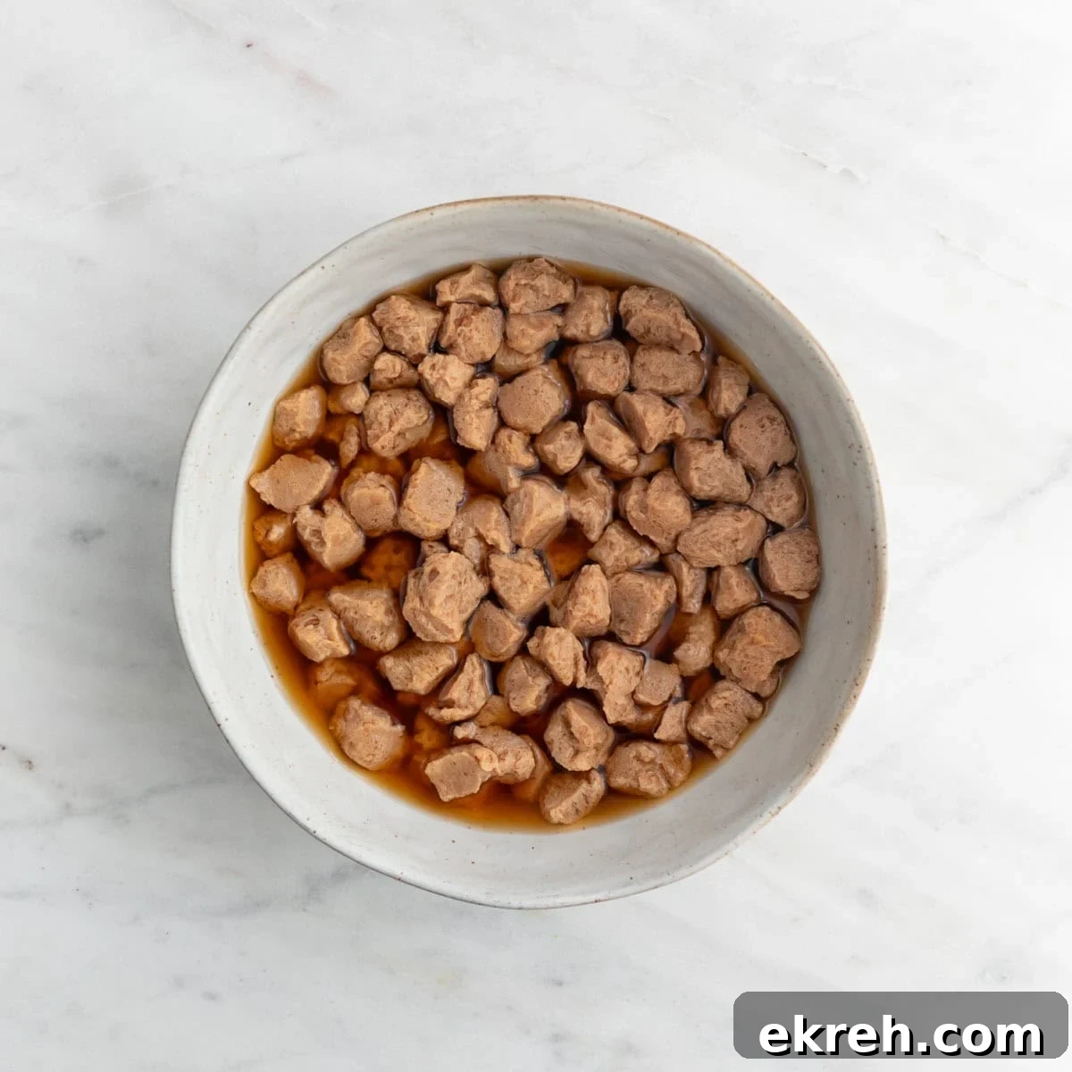 Hearty Vegan Beef-Style Stew with Plant-Based Chunks 4 TVP chunks soaked in water and soy sauce.