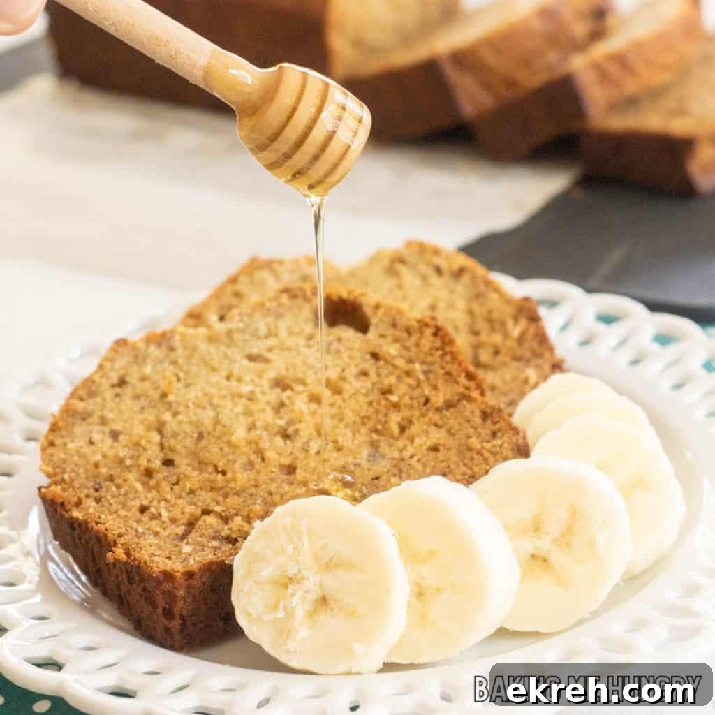 honey banana bread recipe slices on plate being drizzled with extra honey close up