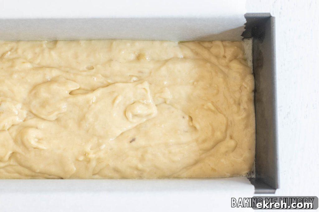 batter in parchment lined pan close up