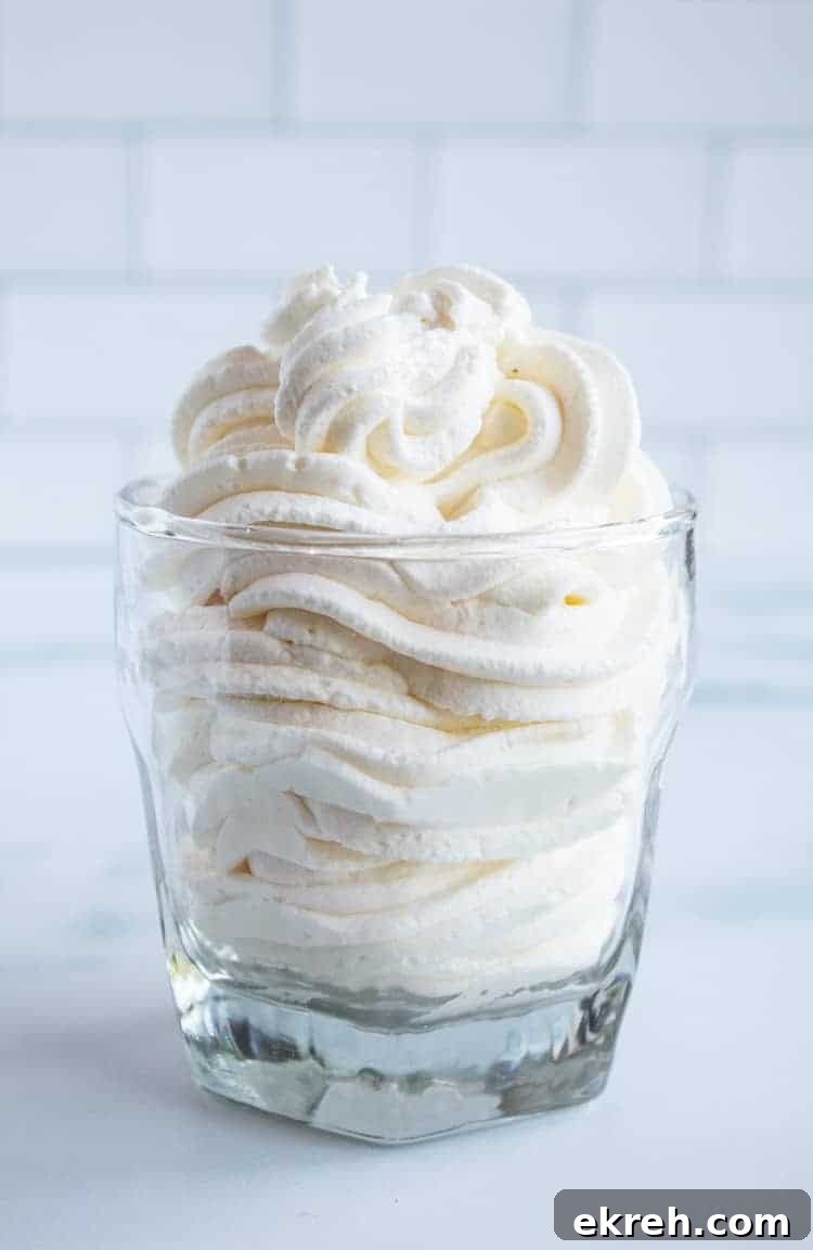 3-Ingredient Keto Whipped Cream Recipe 2 clear glass with piped keto whipped cream inside