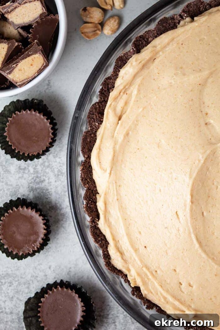 3-Ingredient Keto Whipped Cream Recipe 15 overhead view of keto peanut butter pie in a glass pie dish