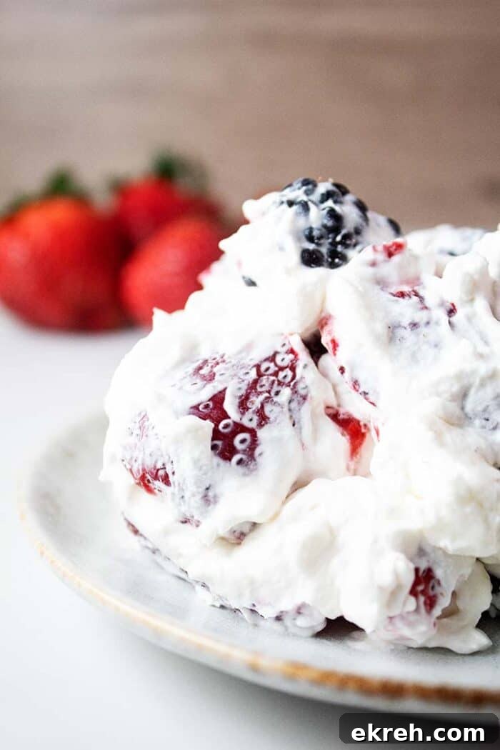 3-Ingredient Keto Whipped Cream Recipe 16 sideview of healthy keto cheesecake fluff on a white serving dish