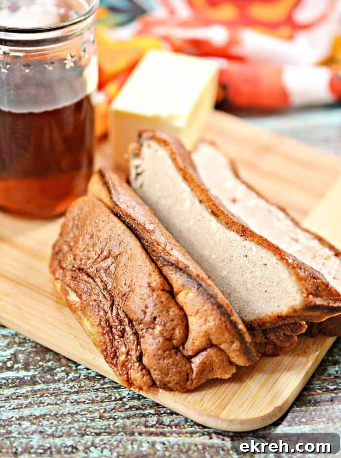 3-Ingredient Keto Whipped Cream Recipe 17 side shot of keto eggloaf sliced on a wooden cutting board