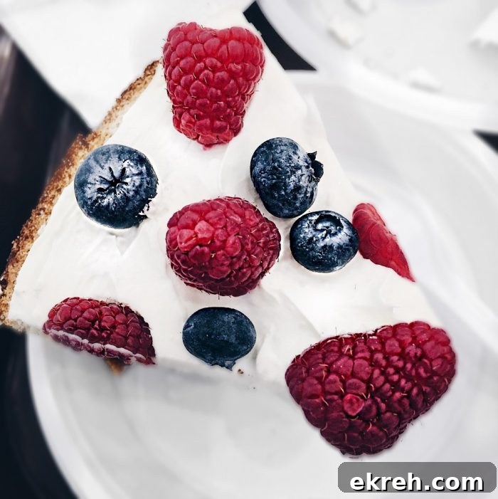 3-Ingredient Keto Whipped Cream Recipe 20 bright keto cheesecake covered with raspberries and blueberries