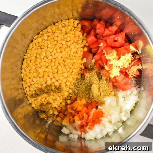 25-Minute Restaurant-Style Dal Tadka Recipe 4 Split pigeon peas, chopped tomatoes and onions, grated ginger and spices in a pot