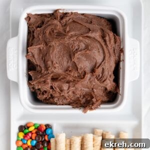brownie dip with add-ins and dippers on a platter