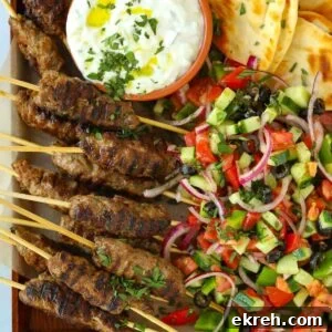 Lamb kofta kebabs recipe with flatbreads and Greek salad and tzatziki.