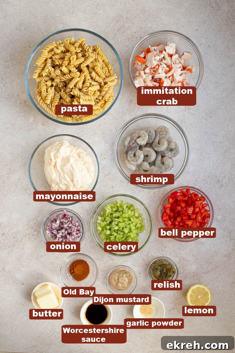 Shrimp and Calamari Seafood Salad with Lemon Vinaigrette 2 All of the ingredients for seafood salad in bowls on countertop.