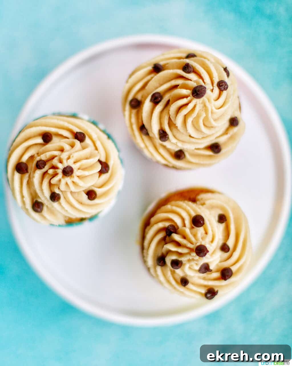 Chocolate Chip Cupcakes with Cookie Dough Frosting Recipe 6 three cupcakes looking down at the cookie dough frosting tops with chocolate chips