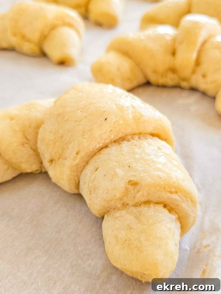 soft and fluffy gluten free crescent roll on a baking sheet