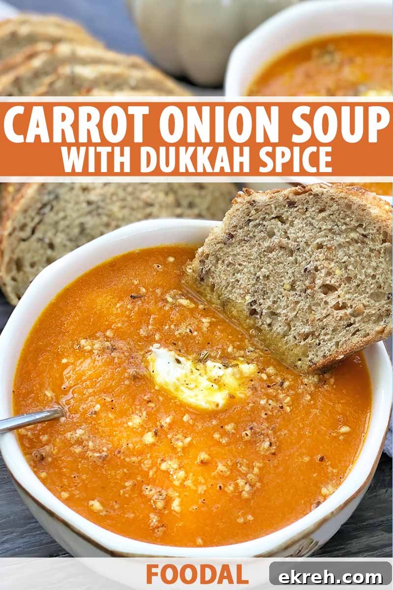 Dukkah-Spiced Roasted Carrot and Onion Soup Recipe 2 Vertical image of a white bowl filled with an orange puree topped with spices with a slice of bread, with text on the top and bottom of the image.
