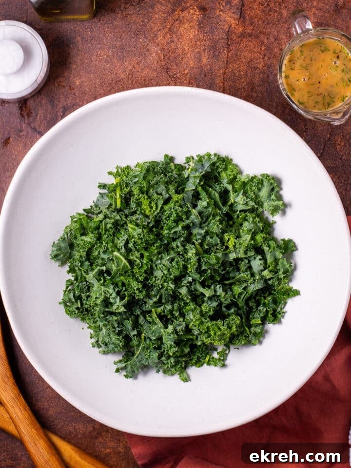 white salad bowl with raw kale
