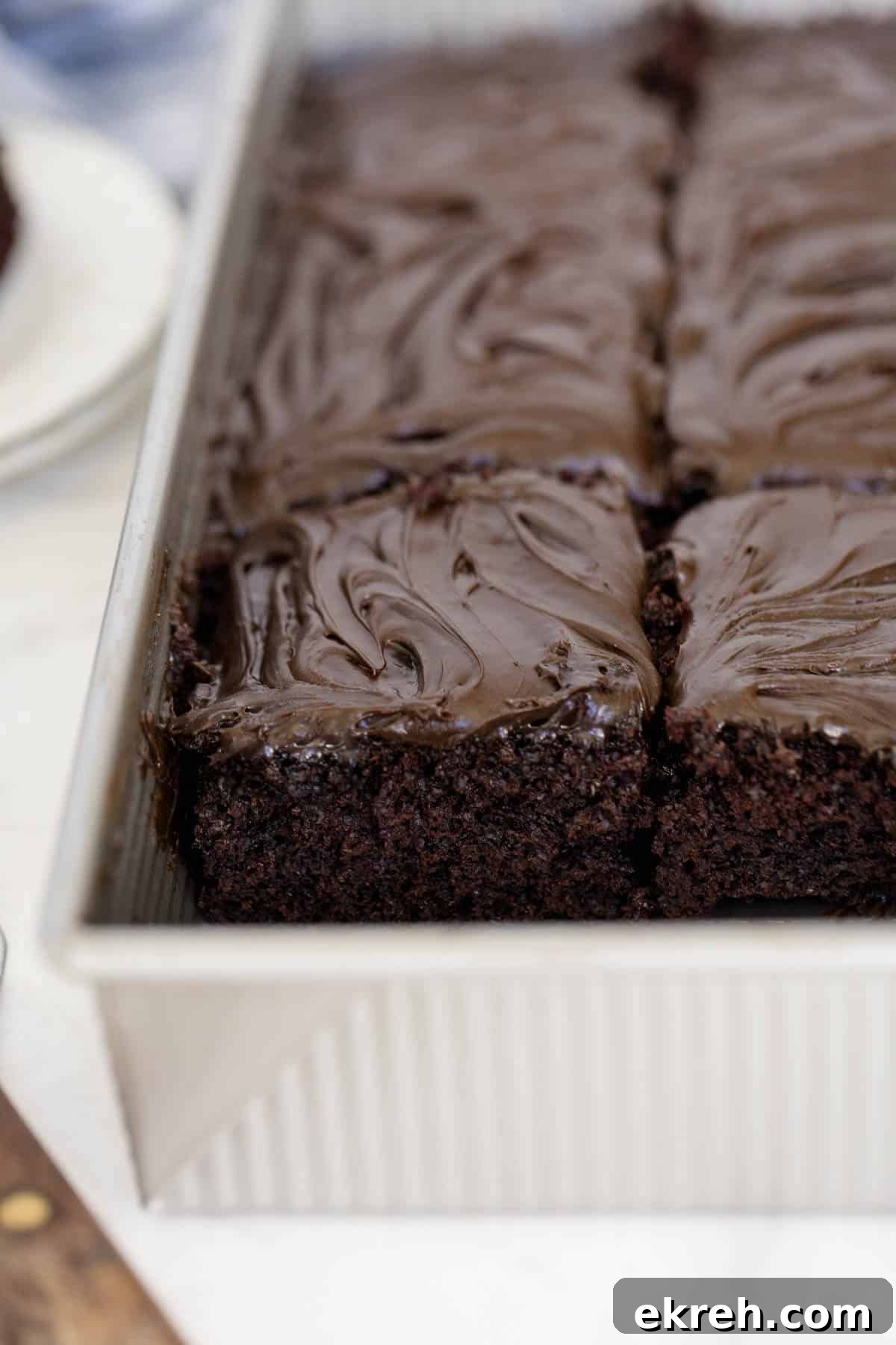 Cake in a pan with slice marks.
