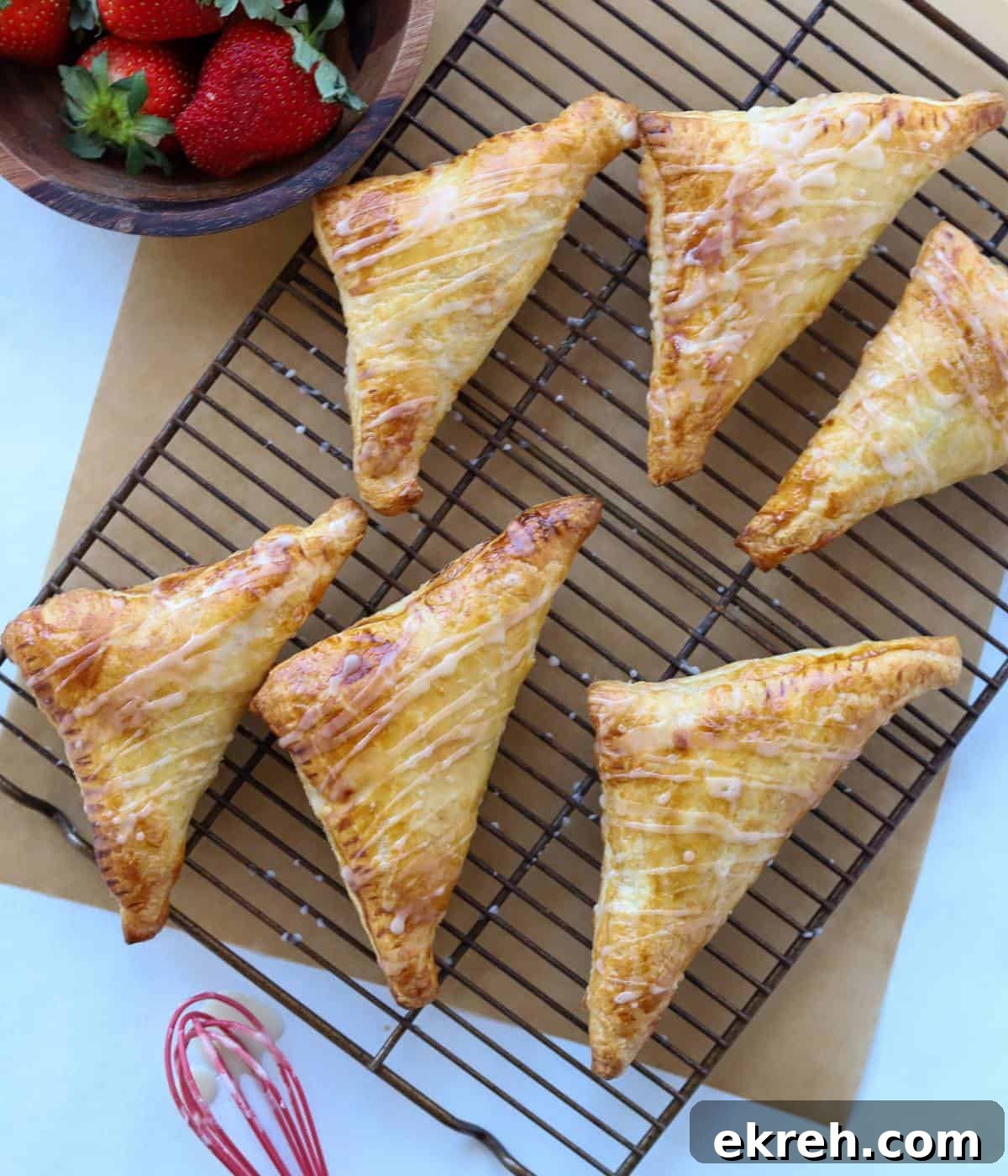 Strawberry turnovers on baking rack. 