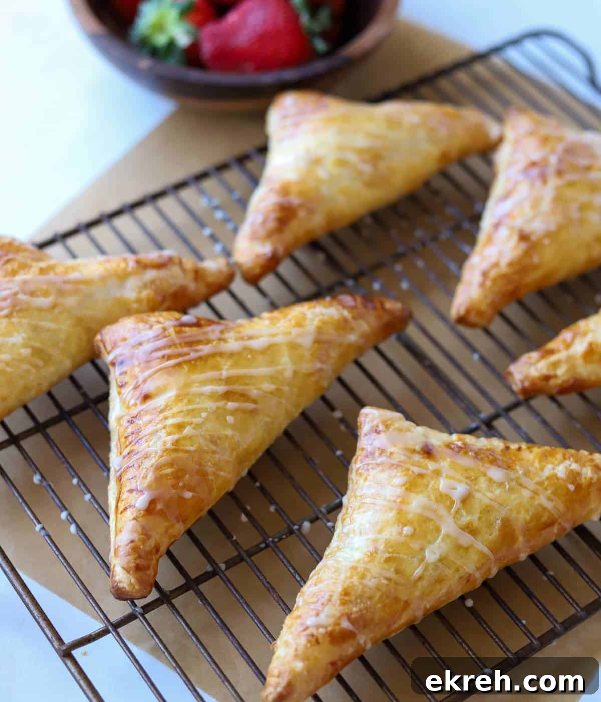 Strawberry turnover pastries on tray.