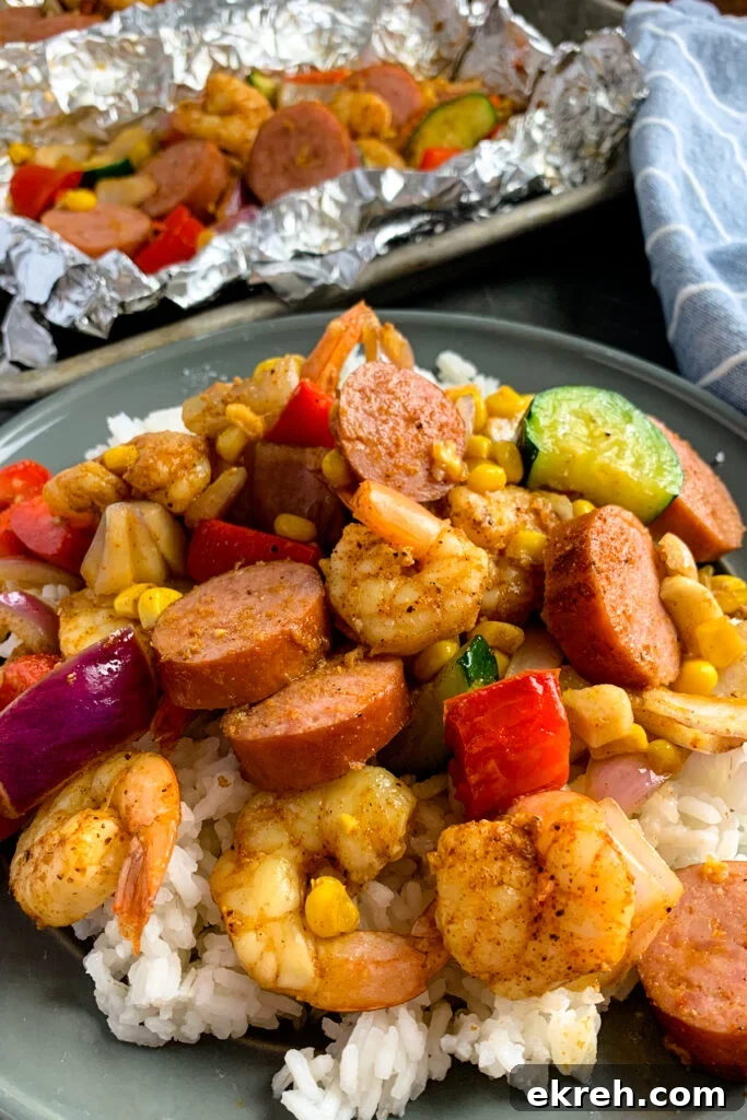 Shrimp, red onions, corn, zucchini, and sausage over a bed of rice.