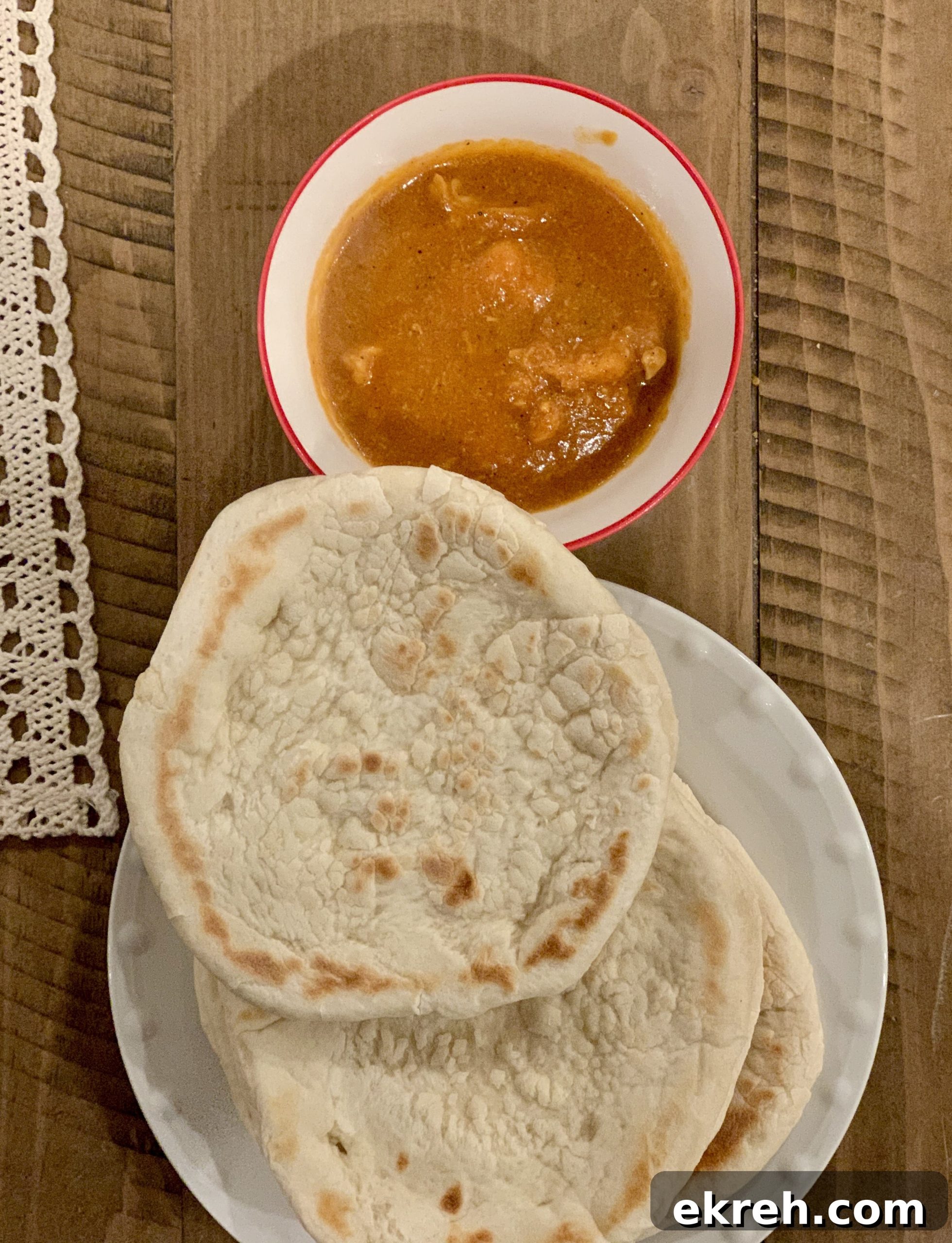 Butter chicken served with naan