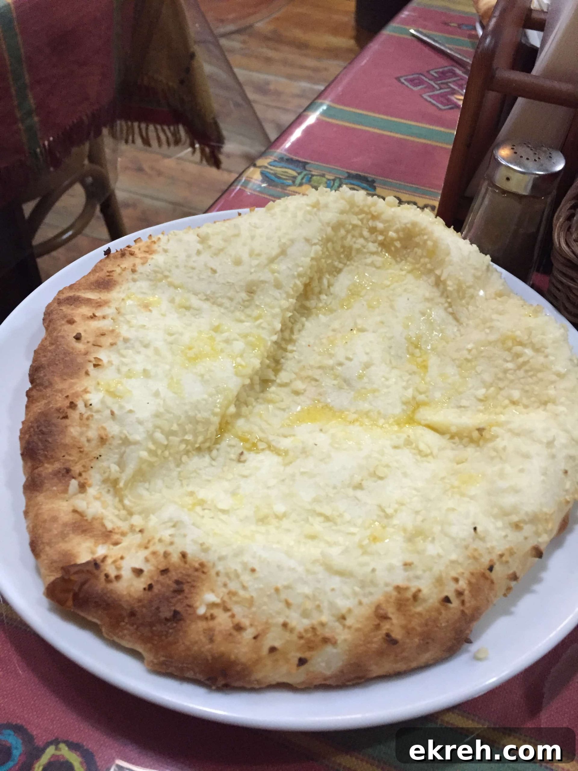 Close up of melted cheese naan