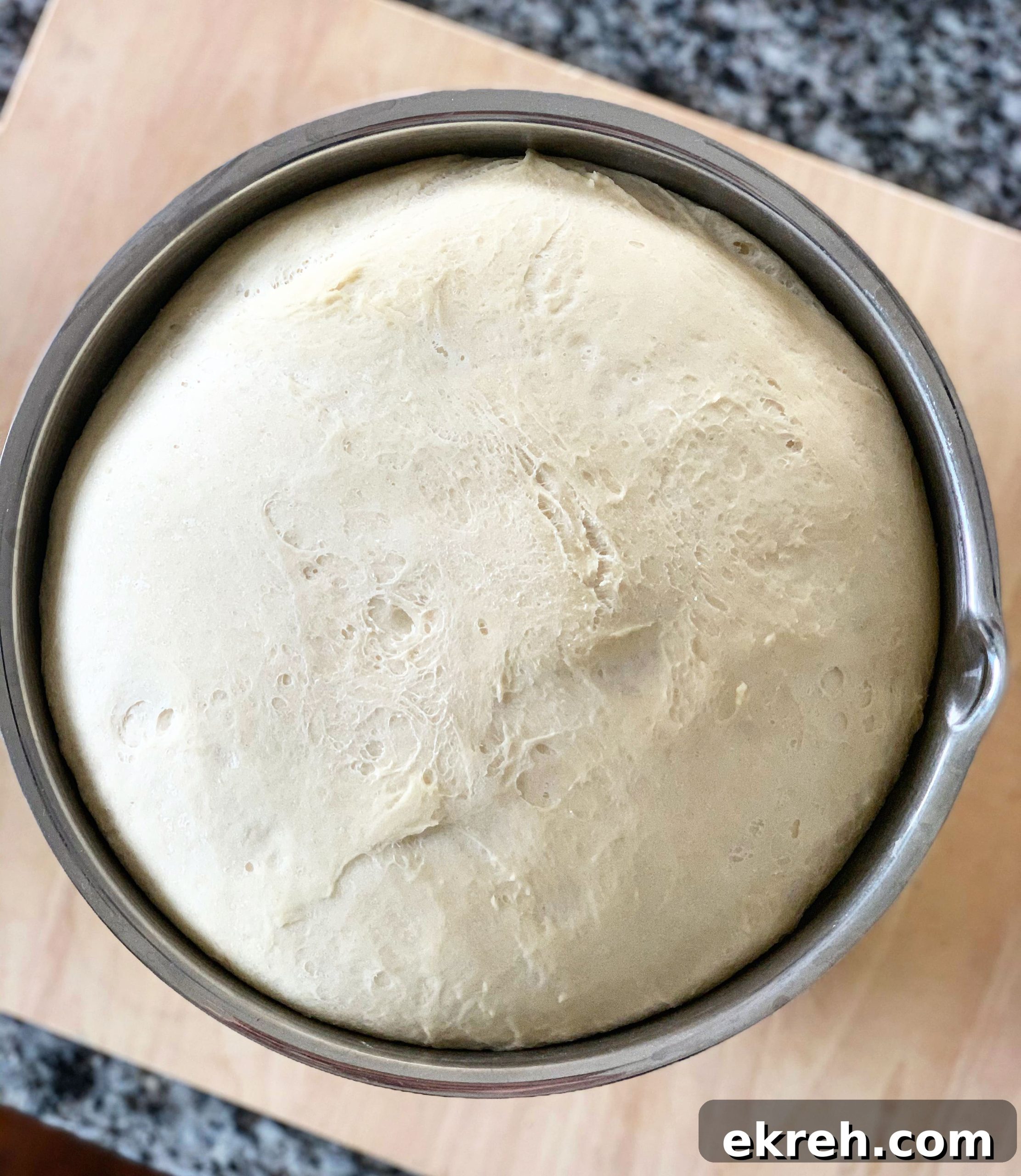 Rolling out naan dough