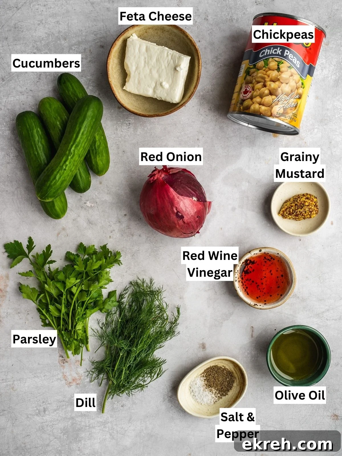 Mediterranean Cucumber, Chickpea and Feta Salad 3 Cucumber chickpea feta salad recipe ingredients with individual labels on a board.