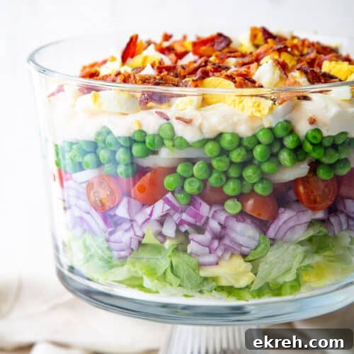 Fennel, Orange and Arugula Salad 8 7 layer salad in a glass trifle dish.