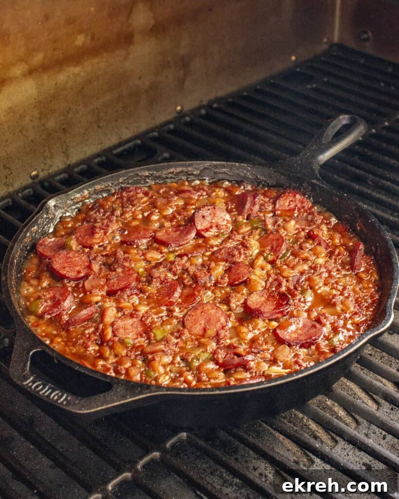 Smoky Loaded Baked Beans with Bacon and Brown Sugar 6 Loaded baked beans served in a cast iron pan