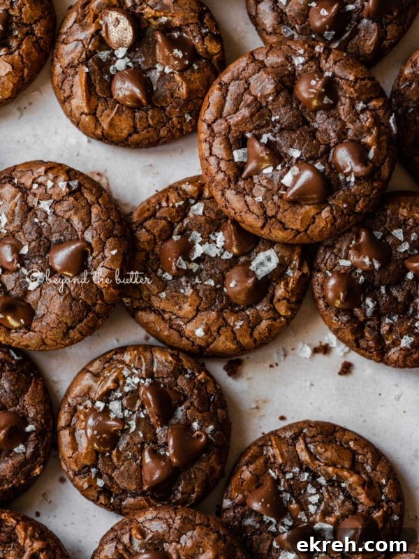 Pumpkin Pie Cake Bars Recipe 9 Salted brownie cookies on abstract light brown background.