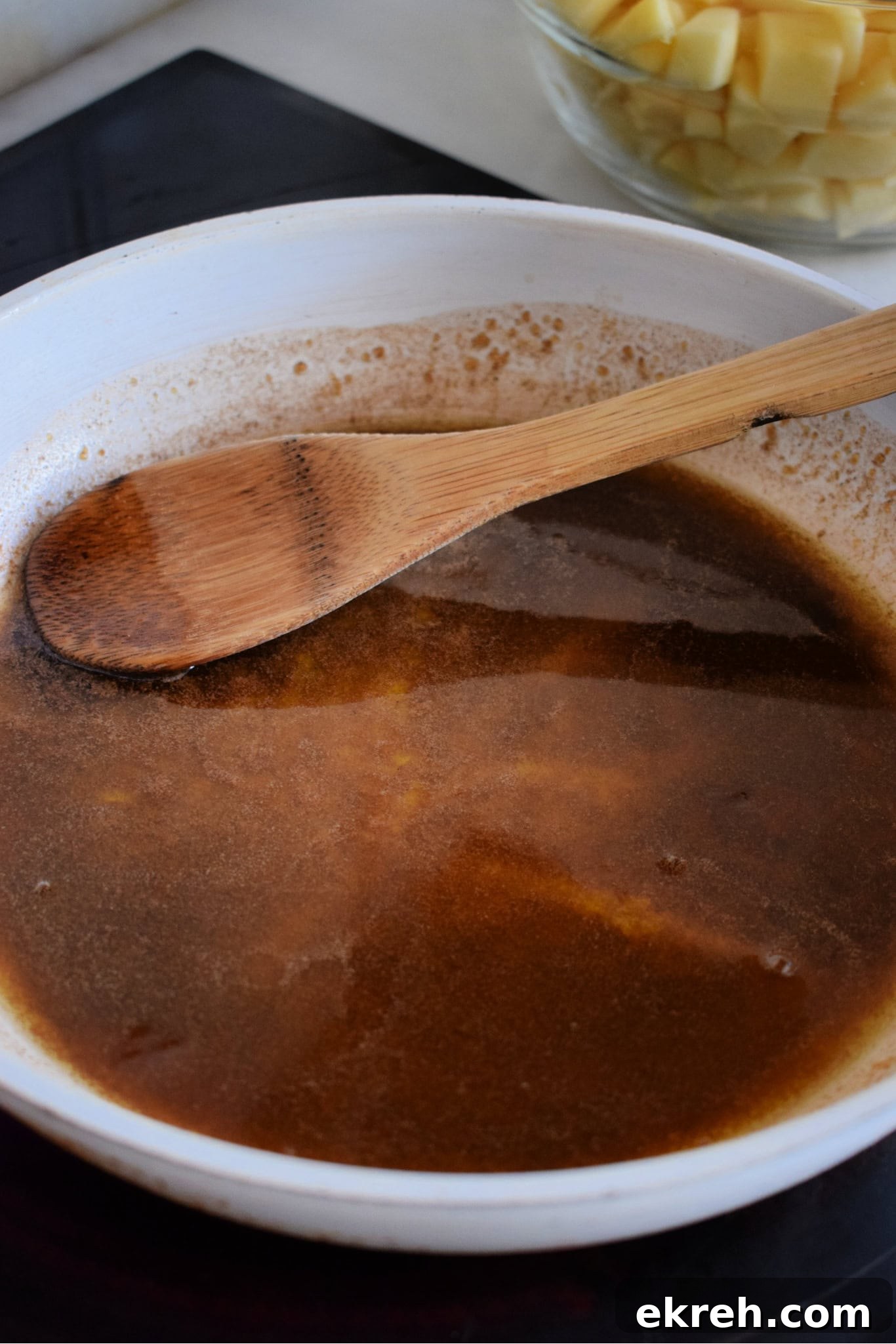 Melted butter with brown sugar in a skillet.