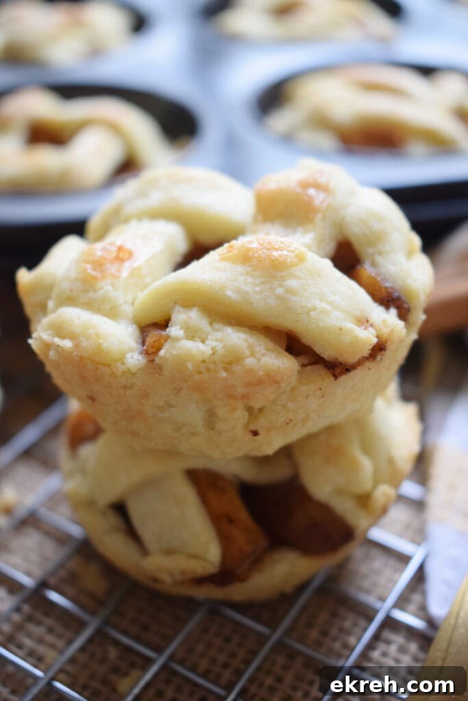 Stacked mini apple pies.