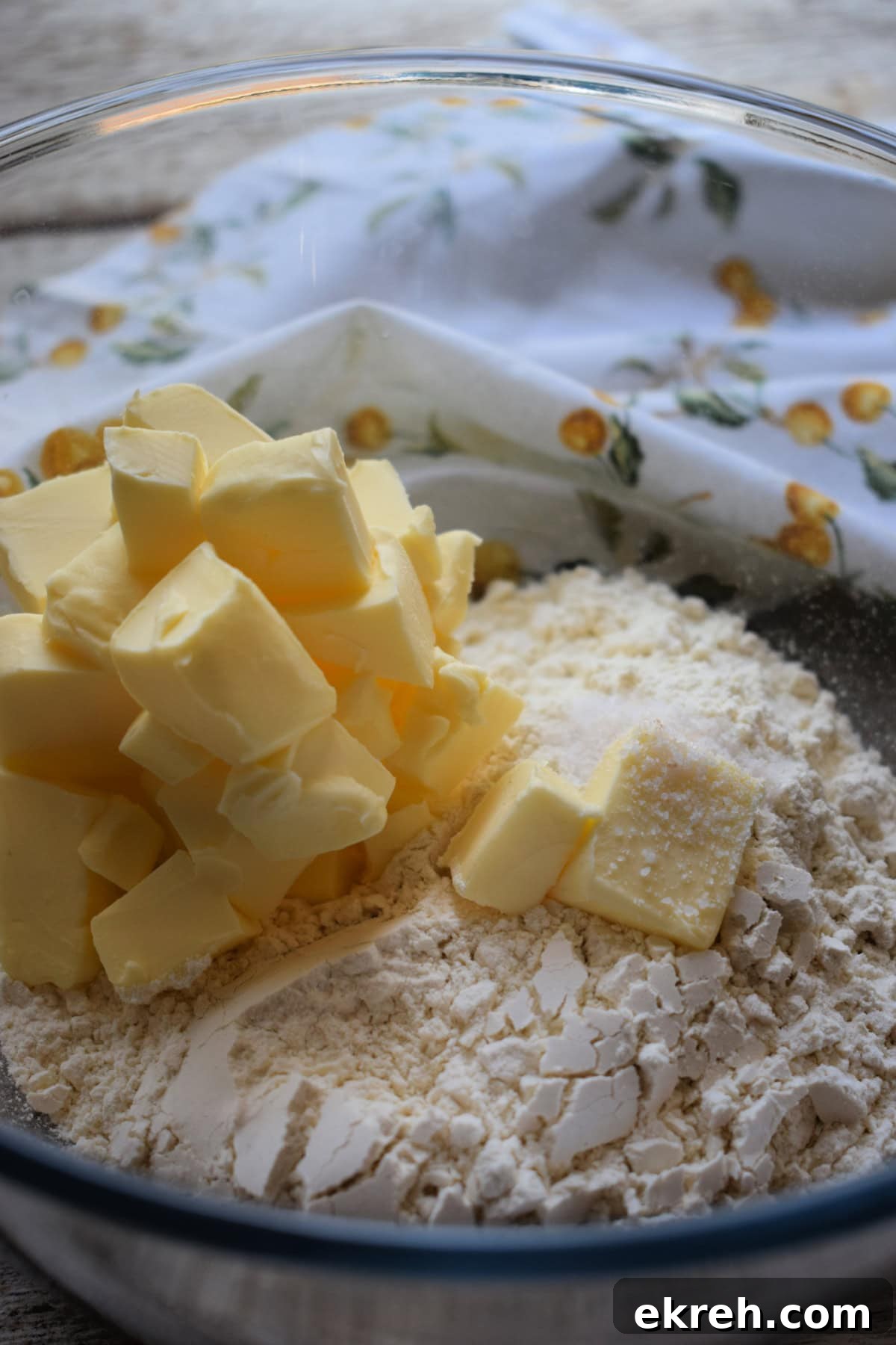 Butter and flour in a bowl to make pastry.