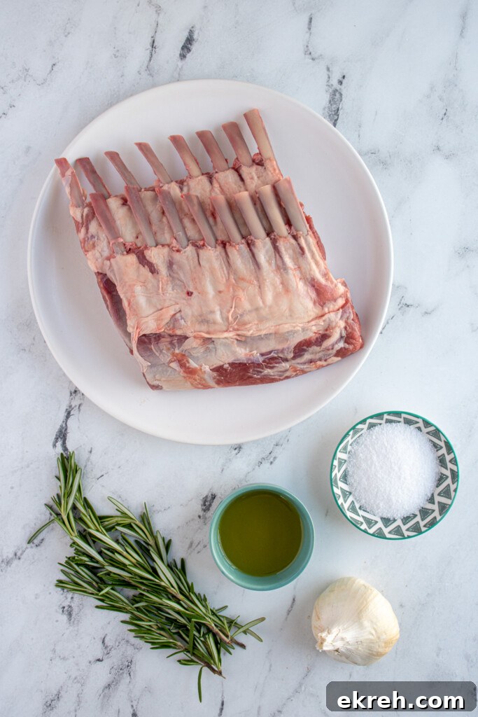 Ingredients needed to make grilled rack of lamb laid out on a marble table top.