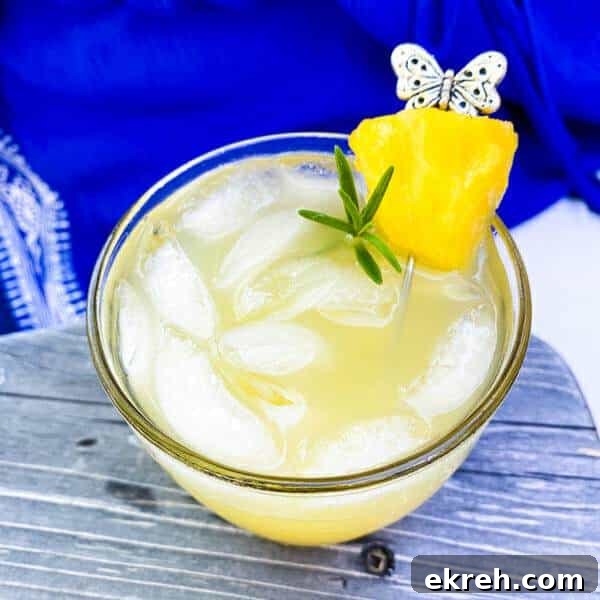 Herb-Infused Simple Syrup Recipe for Cocktails and Mocktails 8 pina romero drink in glass with garnish