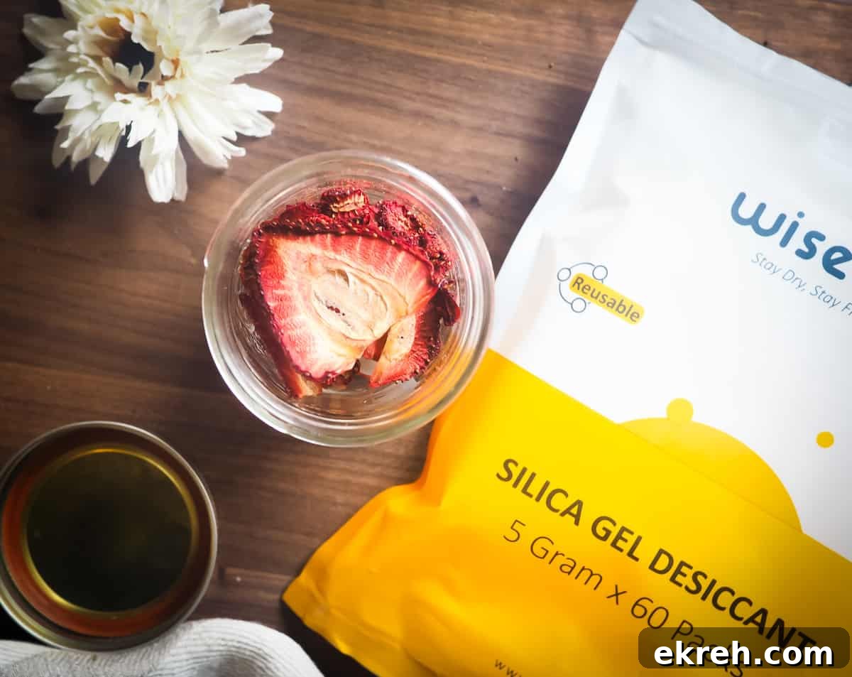 a jar of dehydrated strawberries with a bag of desiccant packs