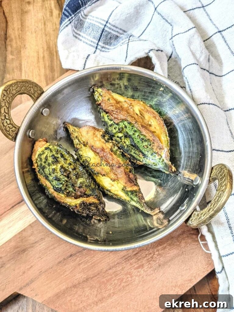 3 air fried karelas kept in a wok.