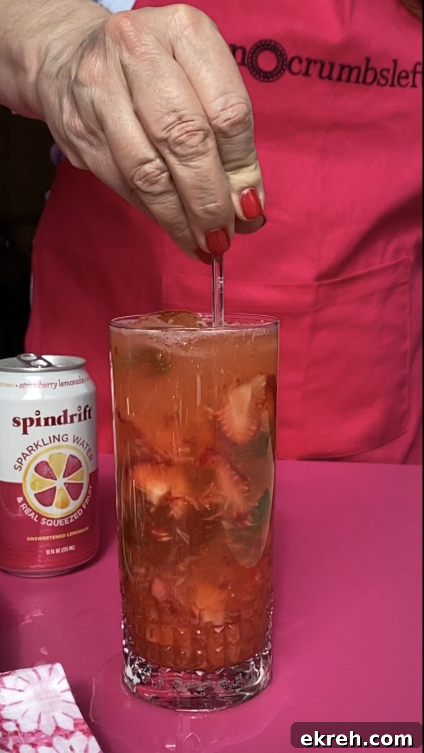 stirring strawberry lemonade mojito