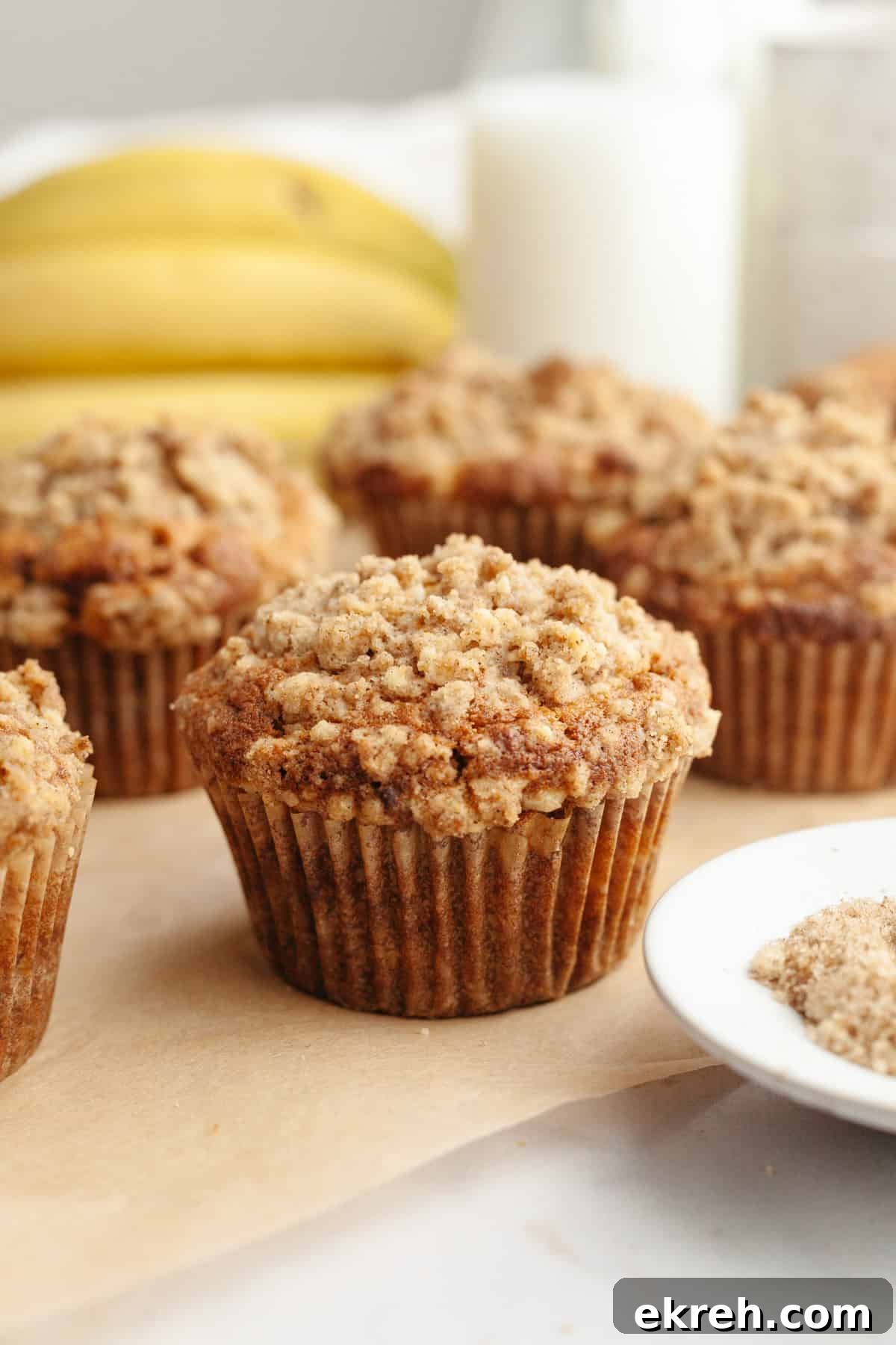 Banana coffee cake muffins with streusel topping.