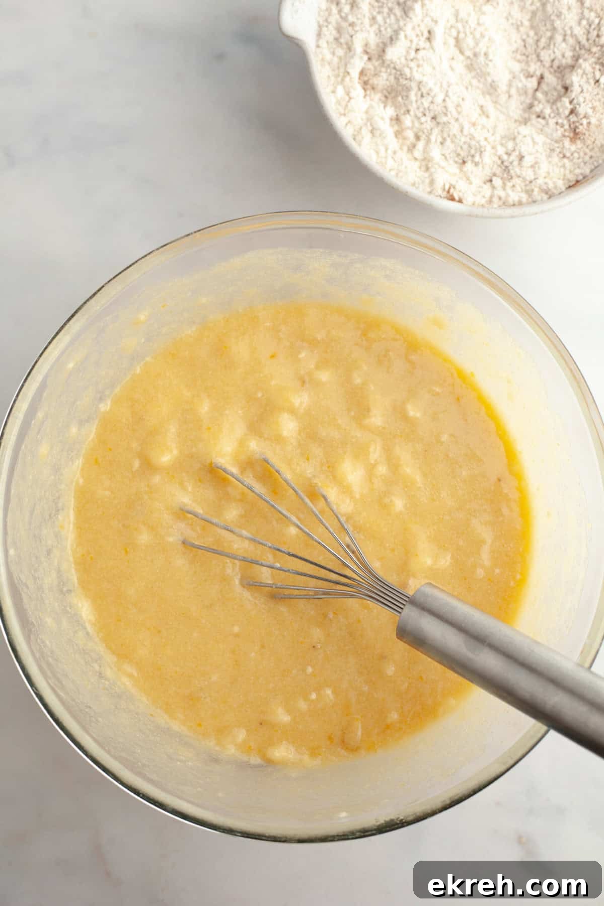 Banana muffin batter in a bowl.