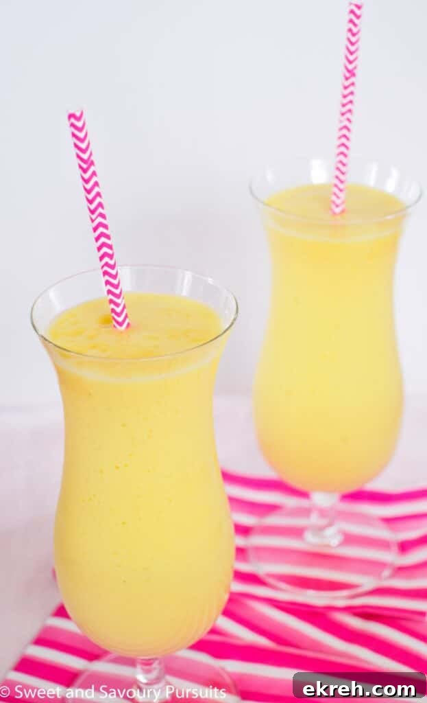 Tropical Pineapple Mango Smoothie Recipe 2 Two pineapple mango smoothies.