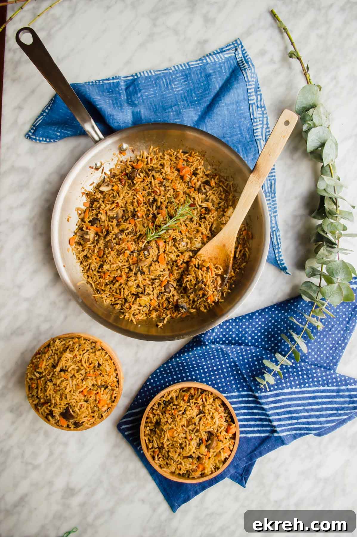 Vegetable Wild Rice in pan and bowls flatlay.