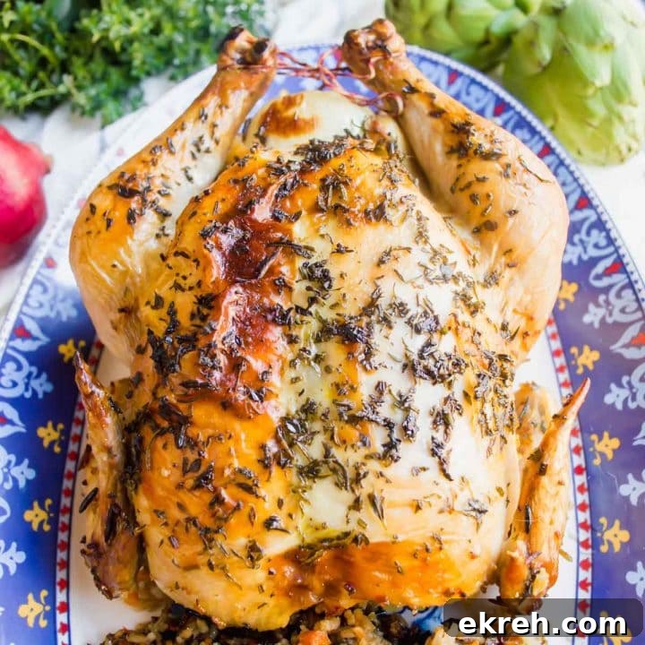Roasted Chicken Stuffed with Wild Rice on plate flatlay.