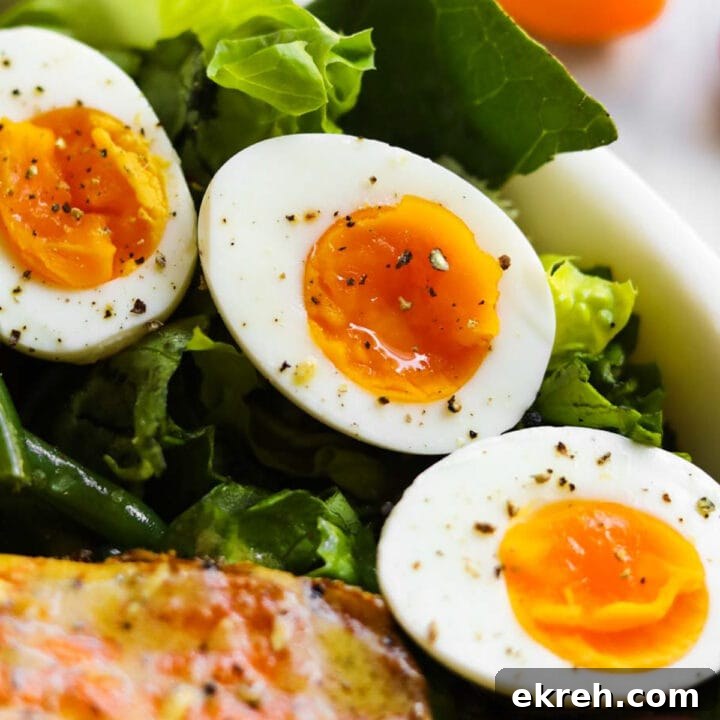 Jammy soft boiled eggs with a creamy orange yolk.
