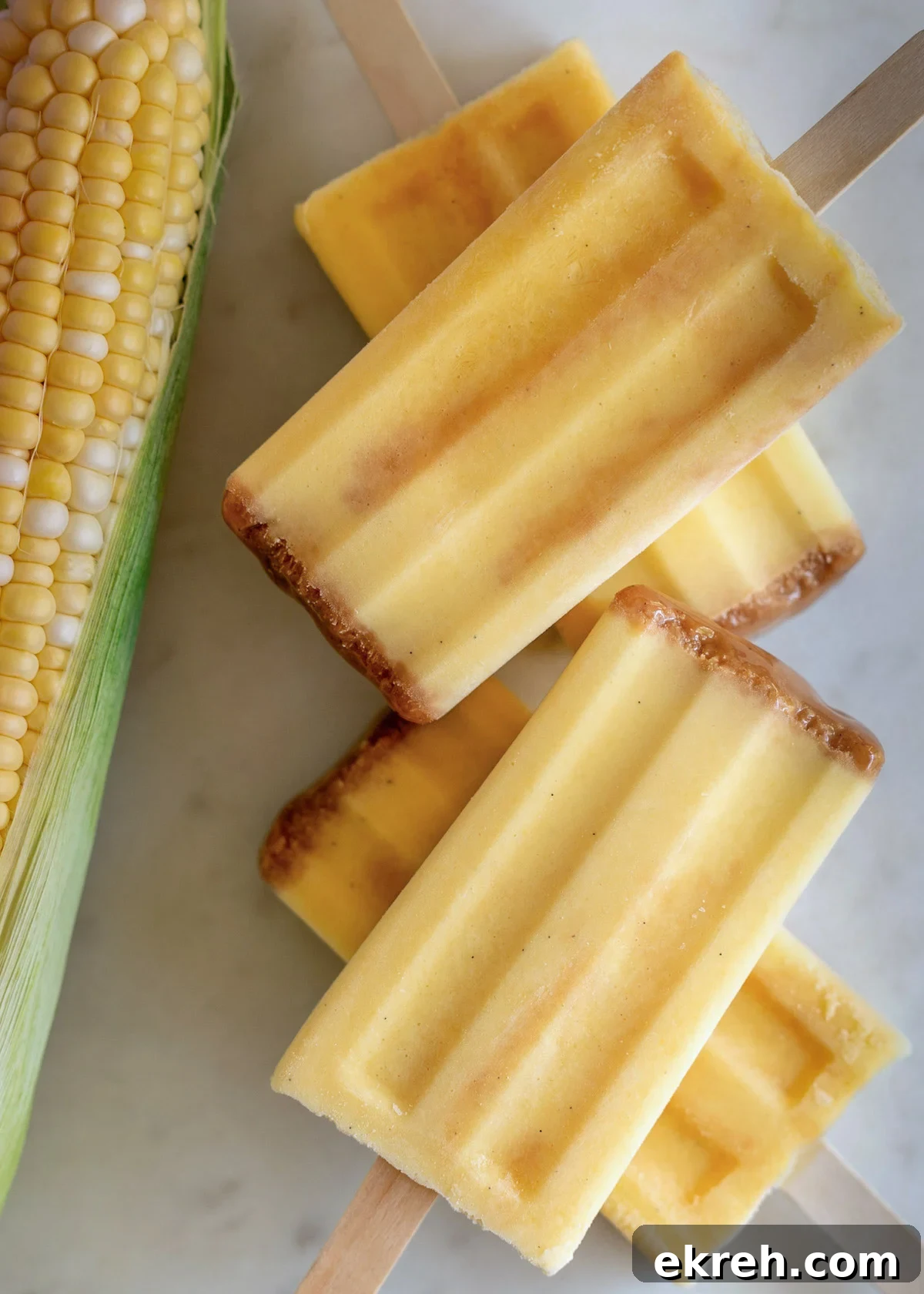 Mexican Corn Paletas with Cajeta (Caramel Ice Pops) 2 stacked corn paletas