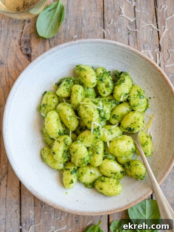Arugula Pesto Gnocchi with Creamy Burrata and Crispy Pancetta 10 An overhead shot of pesto gnocchi in a bowl