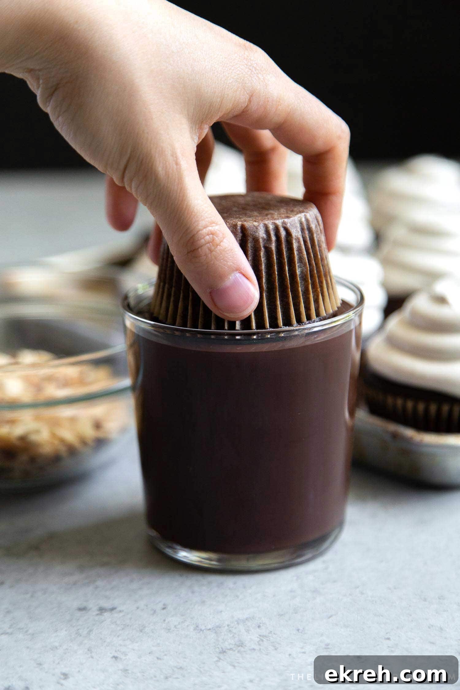 Almond Mocha Hi-Hat Cupcakes. Espresso meringue topped chocolate cupcakes dipped in melted chocolate.