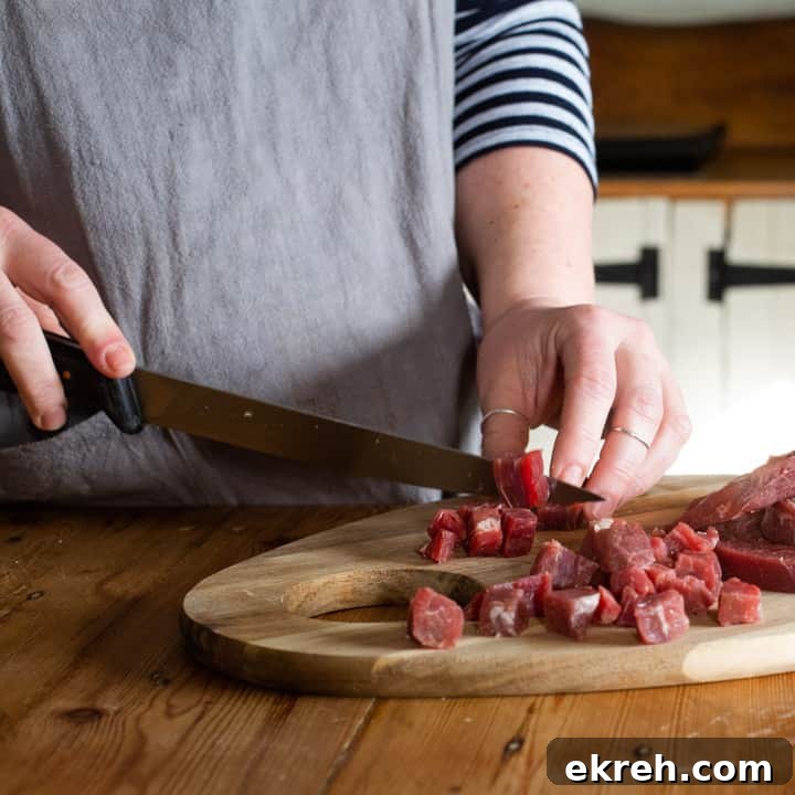 How to Make a Traditional Cornish Pasty (Authentic Recipe) 7 womans hnds dicing beef skirt meat to make a pasty