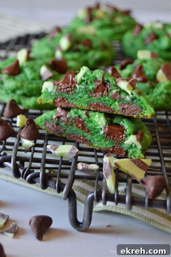 mint chocolate chip cookies stacked on a wire rack