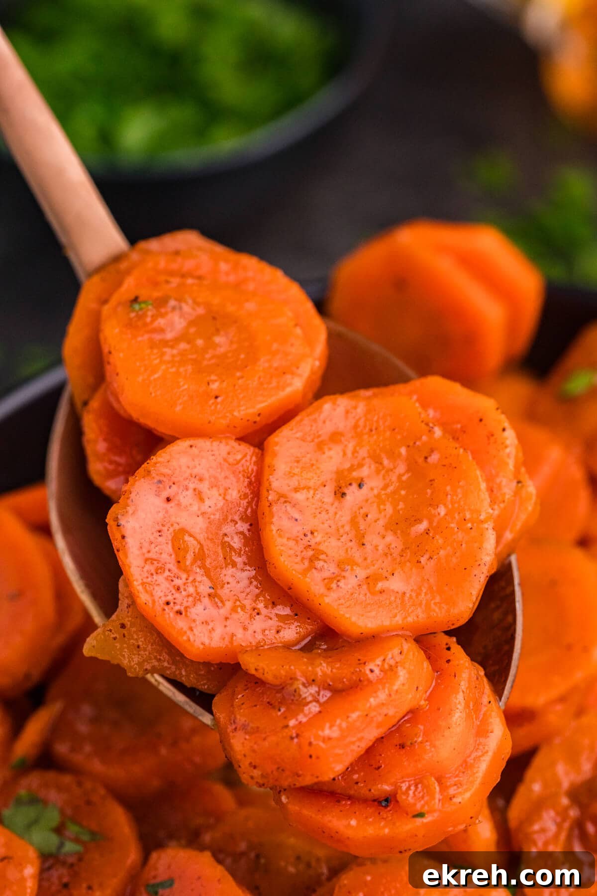Oven-Roasted Maple-Glazed Carrots Recipe 5 The recipe on a serving spoon.