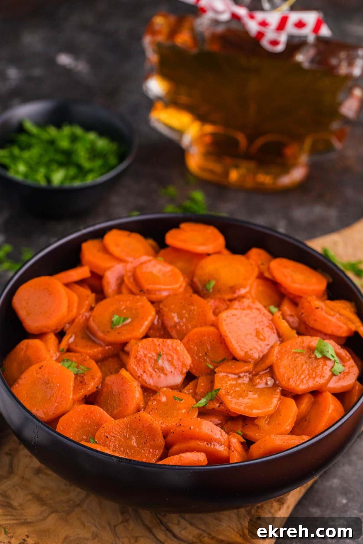 Oven-Roasted Maple-Glazed Carrots Recipe 6 The recipe in a black serving bowl.
