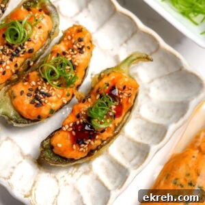 A tempura coated jalapéno with spicy salmon and eel sauce inside.